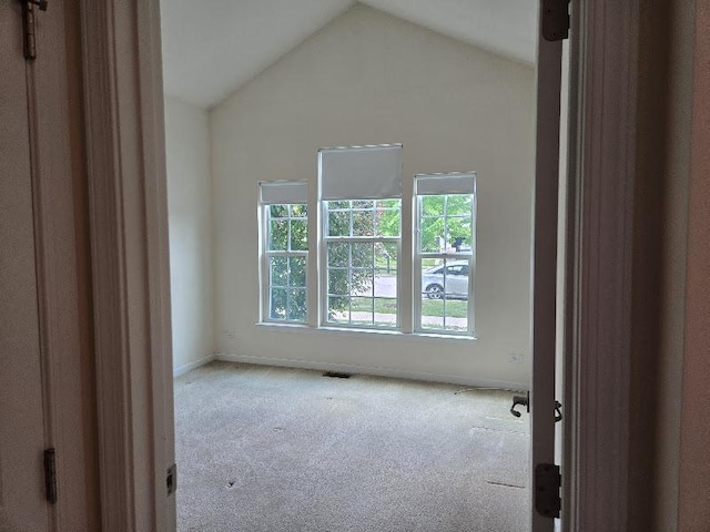 1616 Colchester Ln, Aurora, IL 60502 - unfurnished room featuring carpet floors, vaulted ceiling, and baseboards