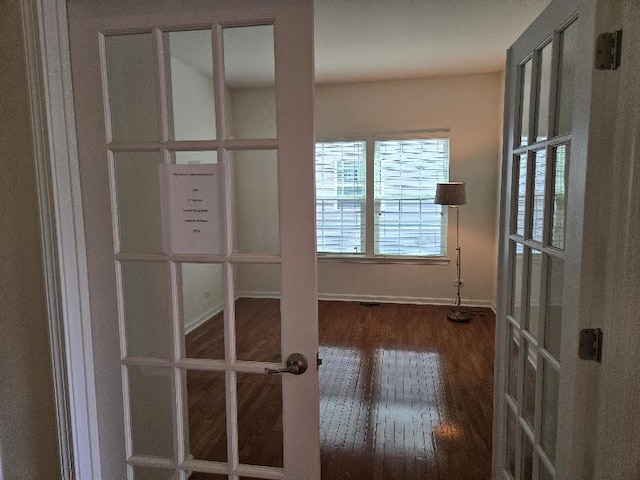 1616 Colchester Ln, Aurora, IL 60502 - hall with french doors, wood finished floors, and baseboards