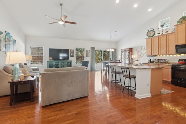 1616 Colchester Ln, Aurora, IL 60502 - living room with a ceiling fan, high vaulted ceiling, wood finished floors, and recessed lighting