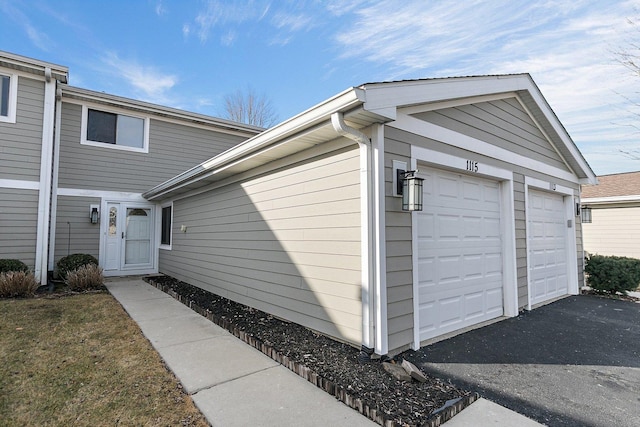 view of property exterior with a garage