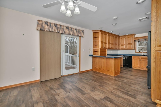 kitchen featuring ceiling fan, black dishwasher, dark hardwood / wood-style flooring, and kitchen peninsula