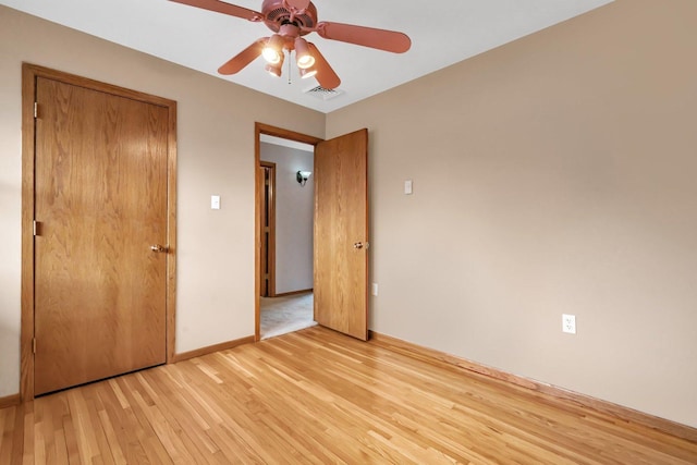 unfurnished bedroom featuring ceiling fan and light hardwood / wood-style floors