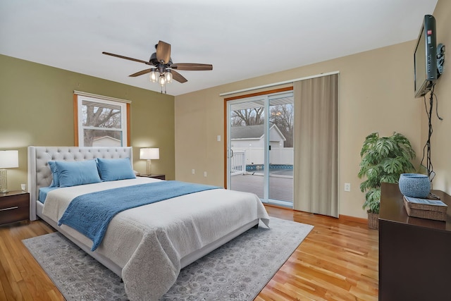 bedroom featuring ceiling fan, access to exterior, and light wood-type flooring