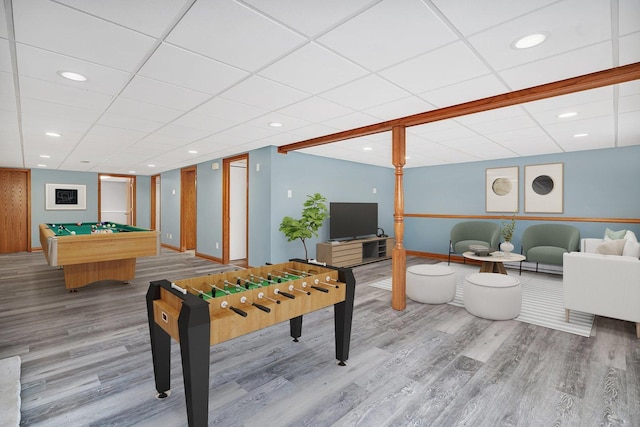 recreation room featuring billiards, wood-type flooring, and a drop ceiling