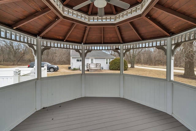 wooden deck with a gazebo and ceiling fan