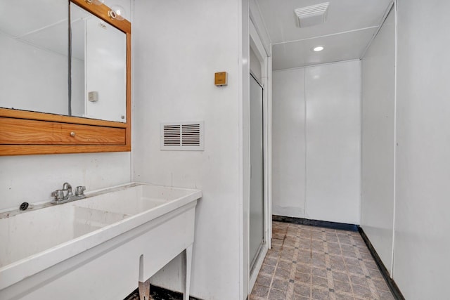 clothes washing area featuring sink