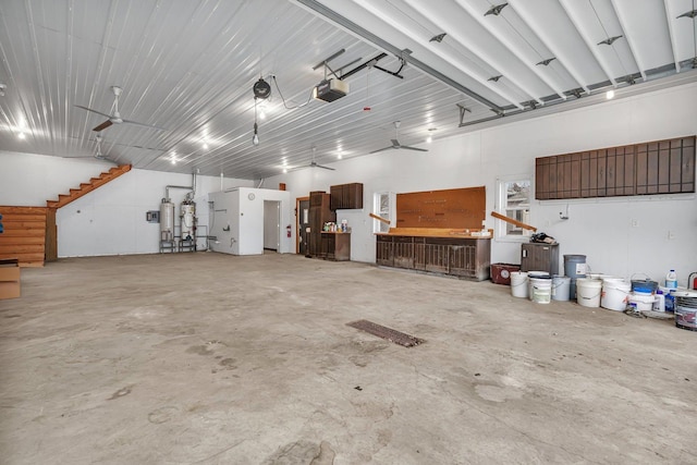 garage with ceiling fan and a garage door opener