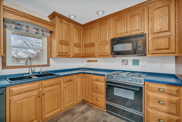 kitchen featuring sink, range with electric stovetop, dark hardwood / wood-style floors, dishwashing machine, and backsplash