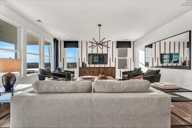 living room featuring hardwood / wood-style floors and a chandelier