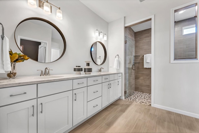 bathroom featuring vanity and walk in shower