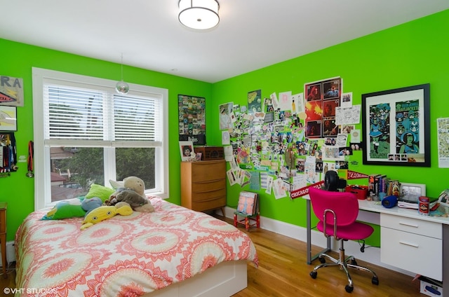 bedroom with light wood-type flooring