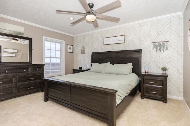 carpeted bedroom featuring crown molding, ceiling fan, and a textured ceiling