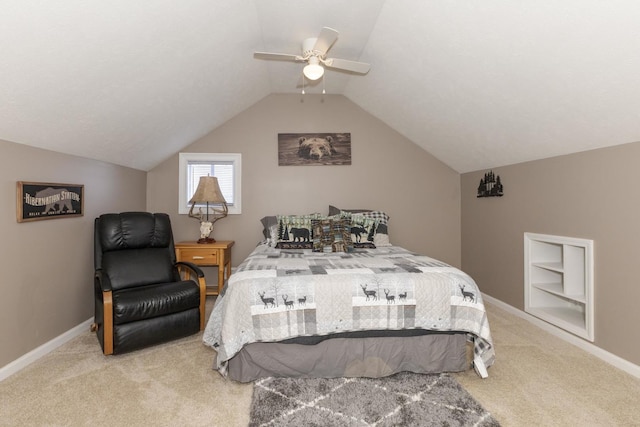 carpeted bedroom with vaulted ceiling and ceiling fan