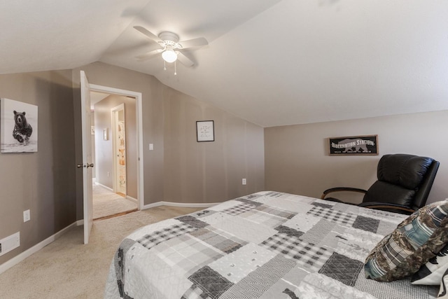 carpeted bedroom with vaulted ceiling and ceiling fan