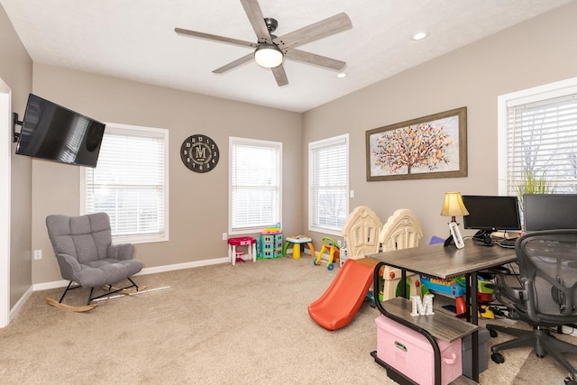 game room featuring carpet floors, a healthy amount of sunlight, and ceiling fan