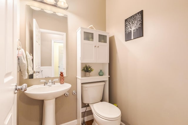 bathroom with toilet and sink