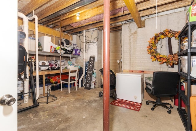 basement featuring refrigerator