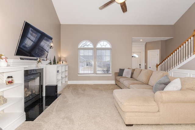 living room with light carpet and ceiling fan