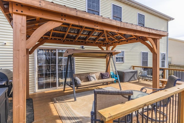 wooden terrace featuring a gazebo and outdoor lounge area