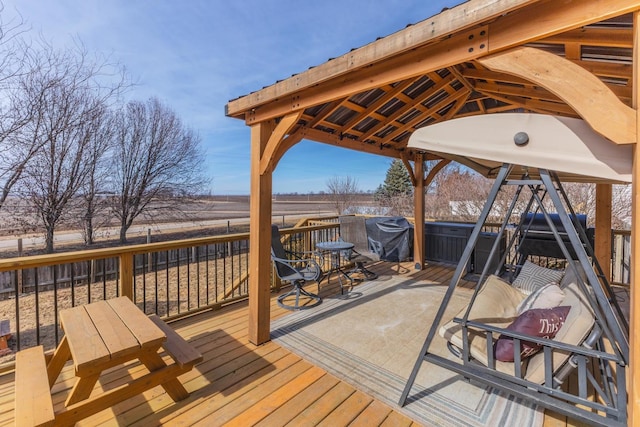 wooden terrace with a hot tub