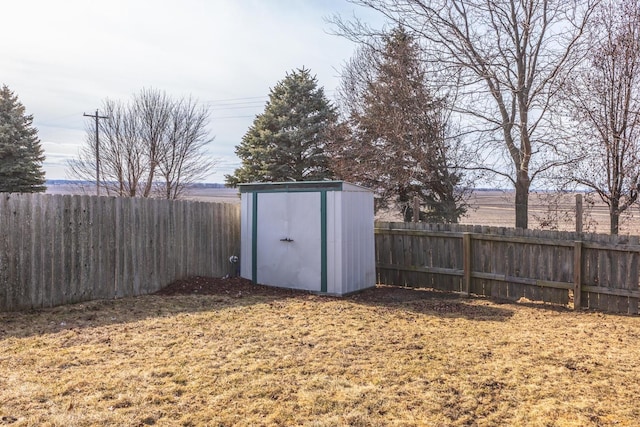 view of outbuilding with a yard