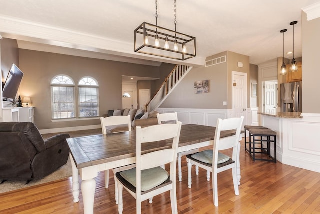 dining space featuring wood-type flooring