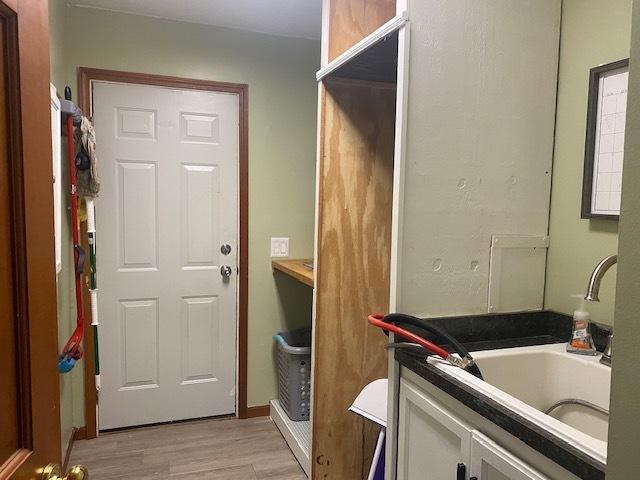 bathroom with vanity and hardwood / wood-style floors