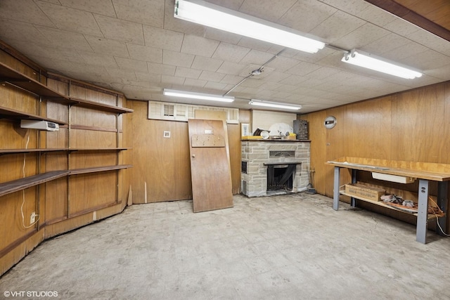 finished below grade area with tile patterned floors and wooden walls