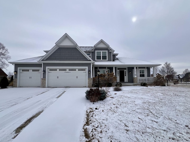 view of front of home with a garage and a porch