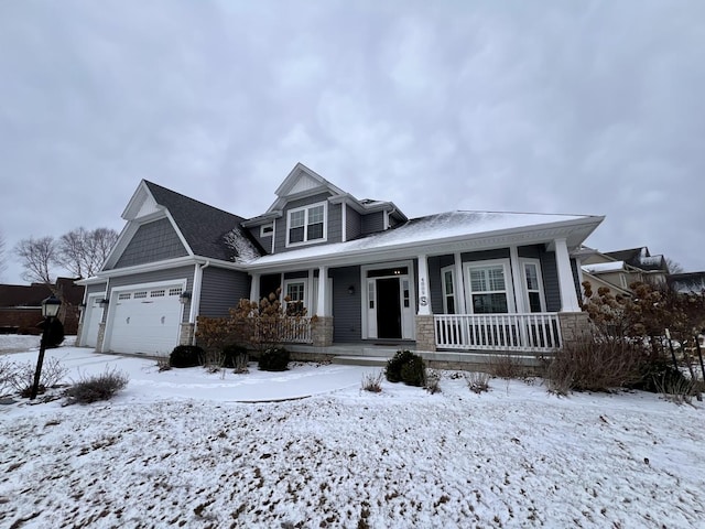 view of front of property with a garage and a porch