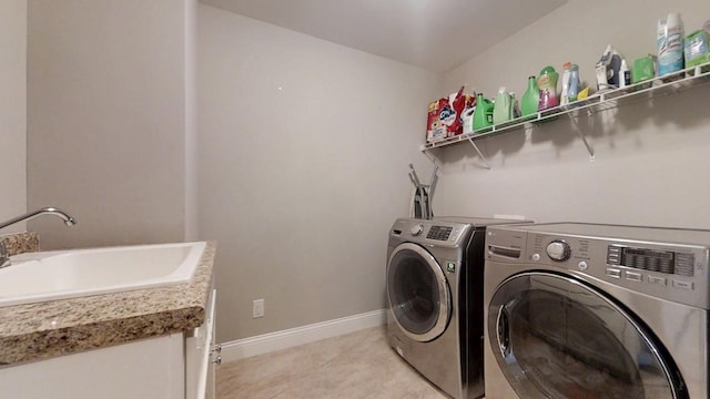 laundry room with sink and washer and clothes dryer