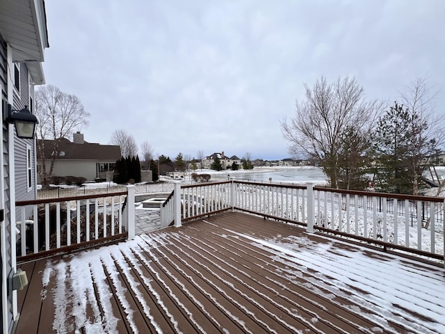 view of snow covered deck