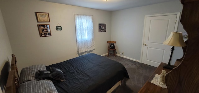 bedroom with dark colored carpet