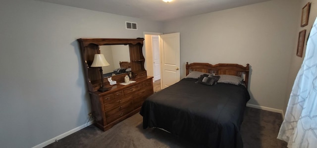 bedroom featuring dark colored carpet