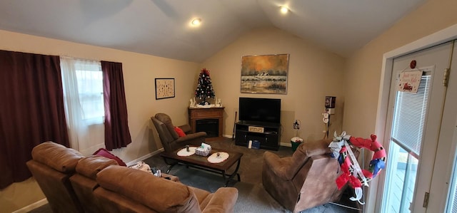 carpeted living room featuring vaulted ceiling