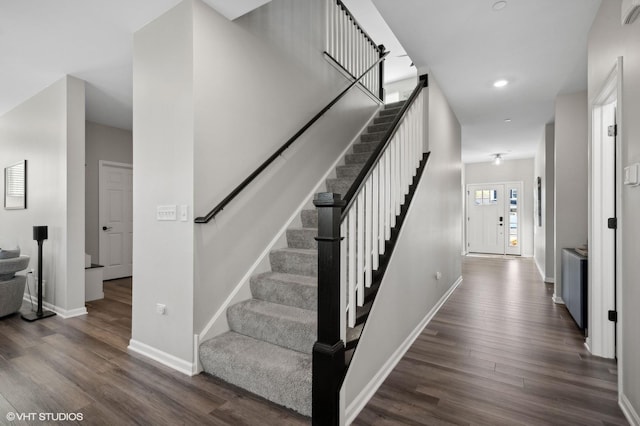 stairs with wood-type flooring