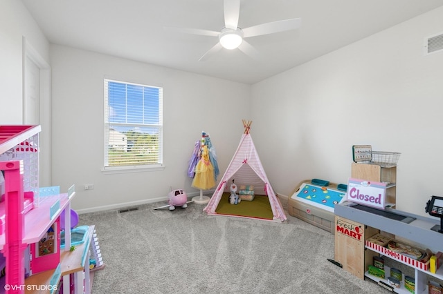 recreation room with carpet flooring and ceiling fan