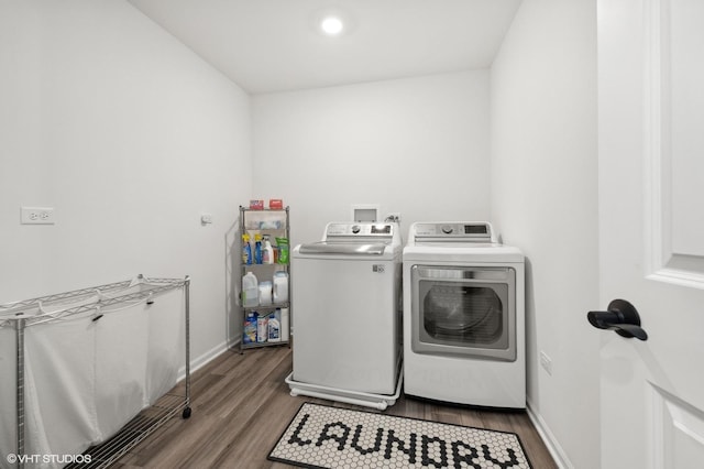 laundry area with independent washer and dryer and hardwood / wood-style floors