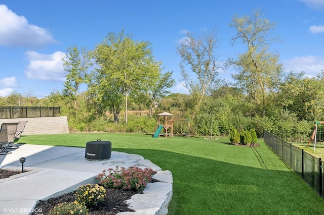 view of yard featuring a patio area and a playground