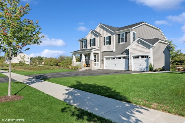 view of front of home featuring a garage and a front lawn