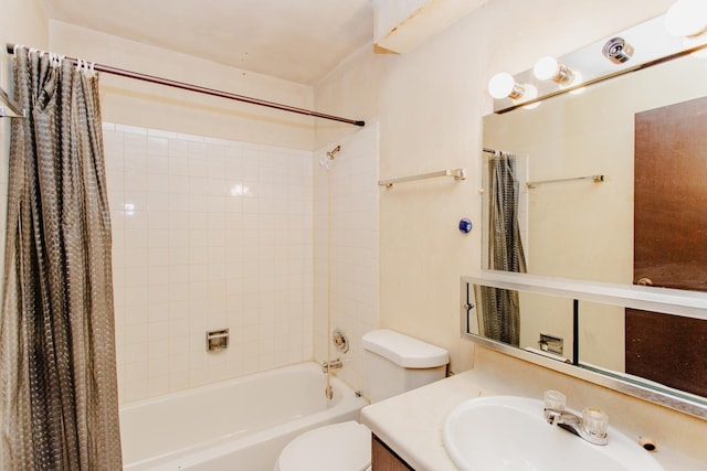 full bathroom featuring shower / bath combo, vanity, and toilet