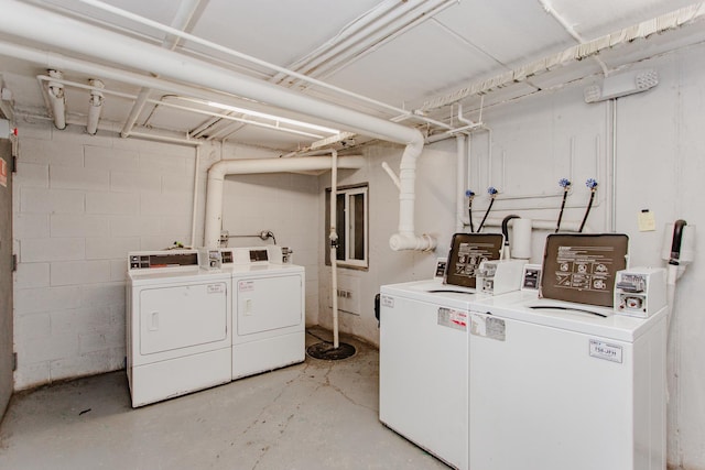 clothes washing area featuring washer and clothes dryer