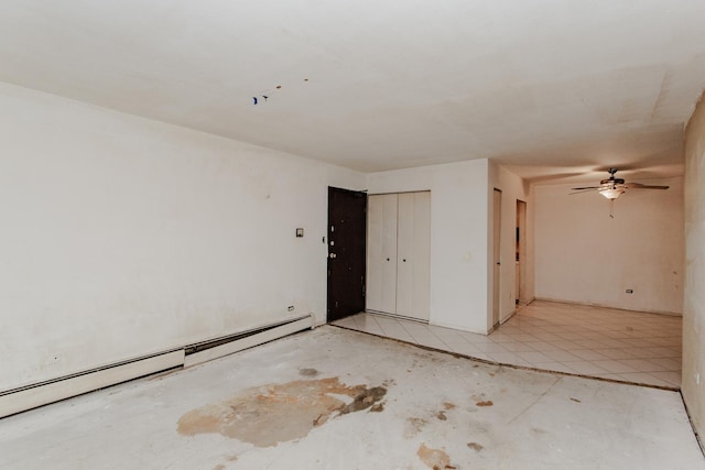 empty room featuring baseboard heating