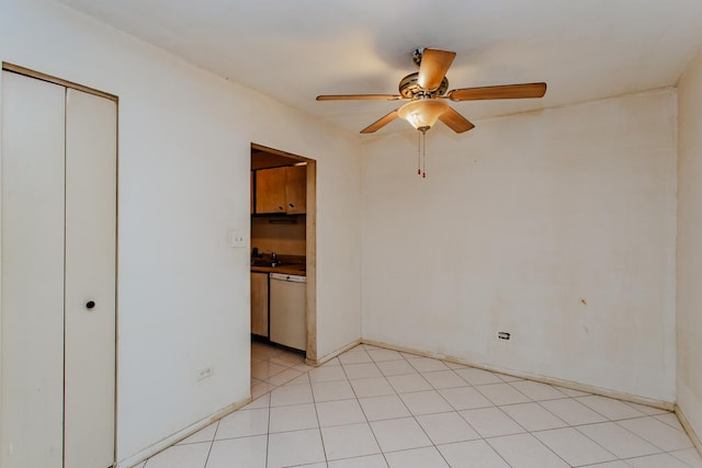 unfurnished bedroom with sink, a closet, and ceiling fan