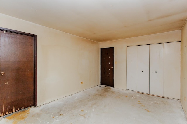 unfurnished bedroom with a closet