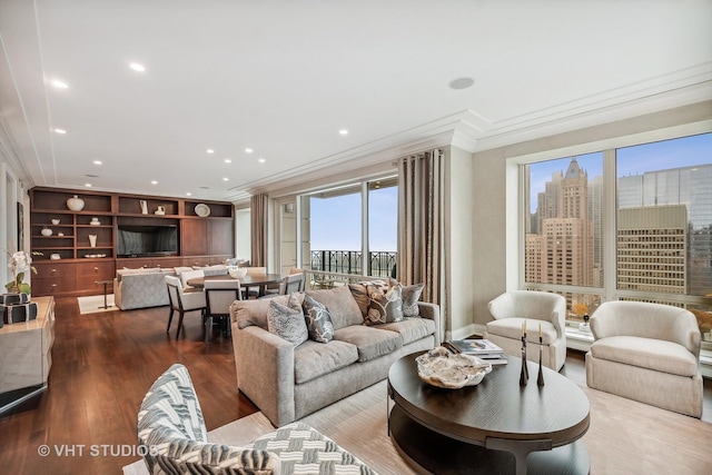 living room featuring crown molding, a wealth of natural light, and hardwood / wood-style floors