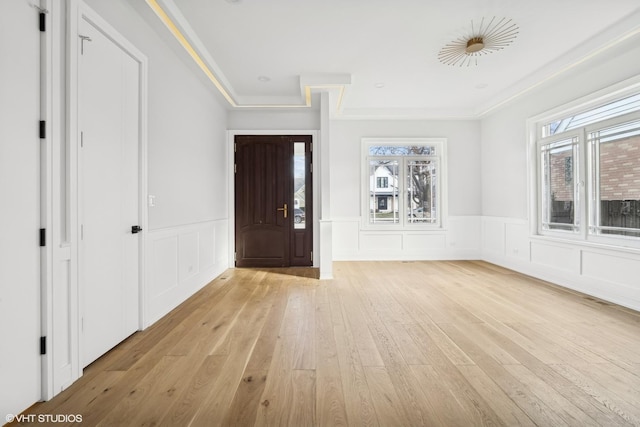 foyer with plenty of natural light and light hardwood / wood-style flooring