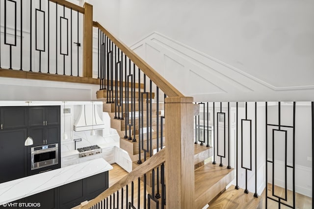 stairs with hardwood / wood-style flooring