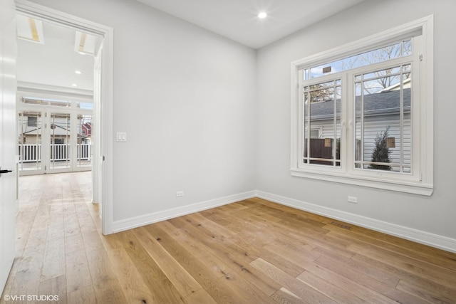 spare room featuring light hardwood / wood-style flooring