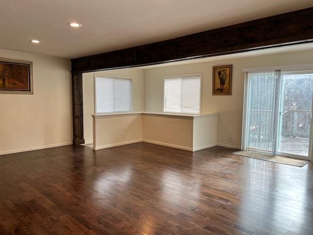 unfurnished room with dark hardwood / wood-style flooring